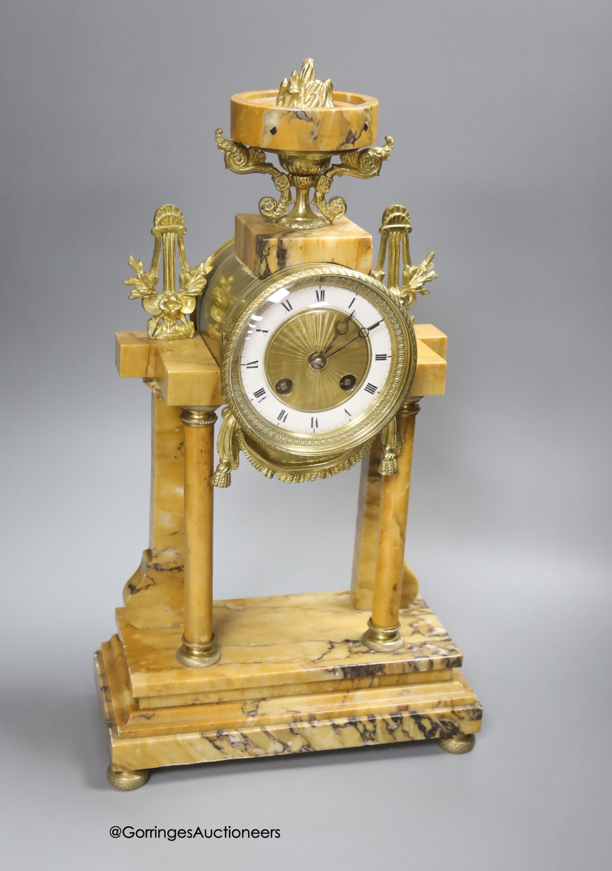 A 19th century French marble and gilt metal mantel clock, with key and pendulum, height 42.5cm